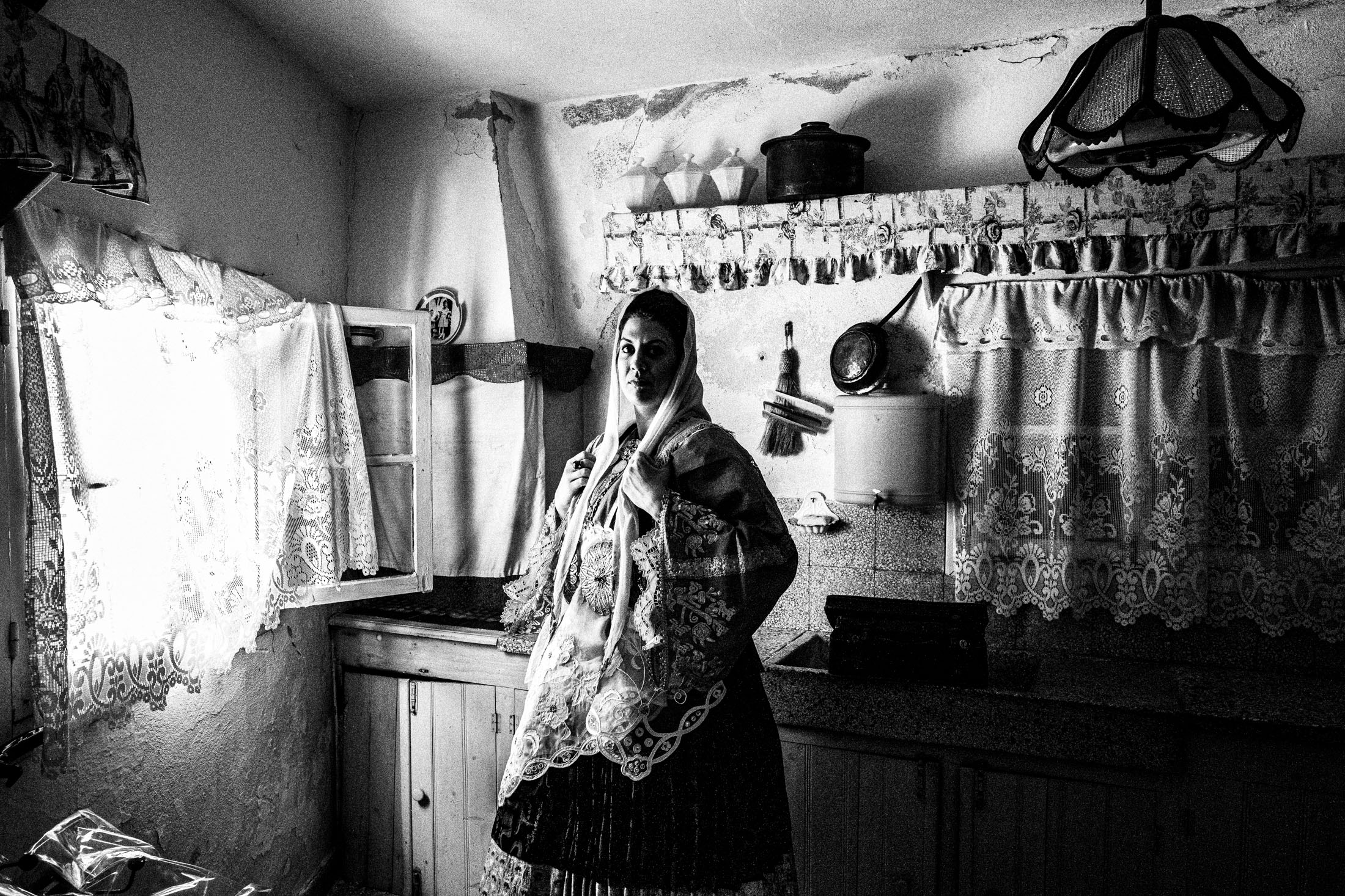 Woman wearing the local costume of Trikeri, Magnesia, inside a local house