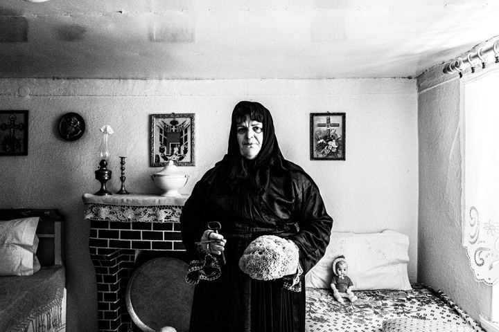 Woman wearing the local costume of Trikeri, Magnesia, inside a local house