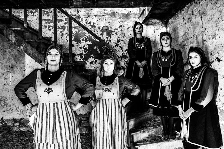Women wearing the rural local dresses inside a local home at the village of Lefki in Kastoria.