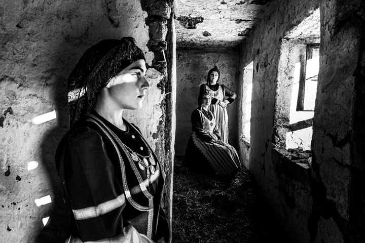 Women wearing the rural local dresses inside a local home at the village of Lefki in Kastoria.