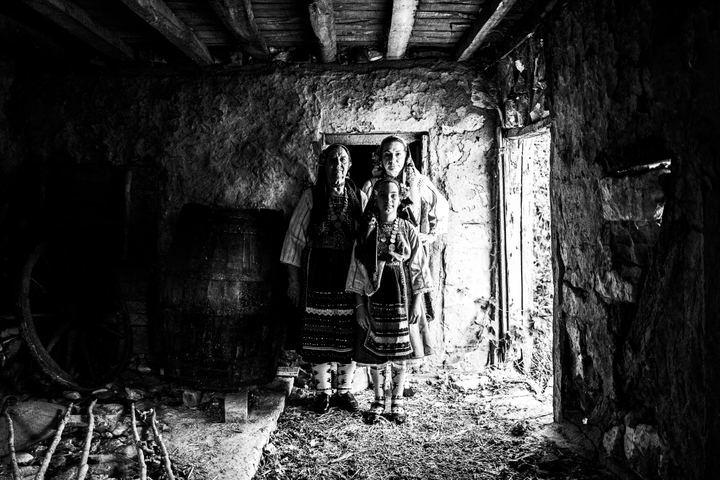 Women wearing the local costume of Metaxades, inside a local house. Evros, Thrace