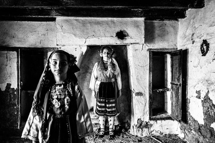 Mother and daughter wearing the local costume of Metaxades, inside a local house. Evros, Thrace