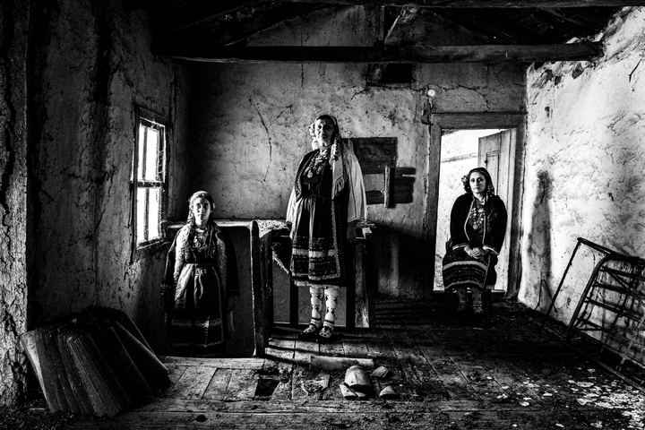 Women wearing the local costume of Metaxades, inside a local house. Evros, Thrace