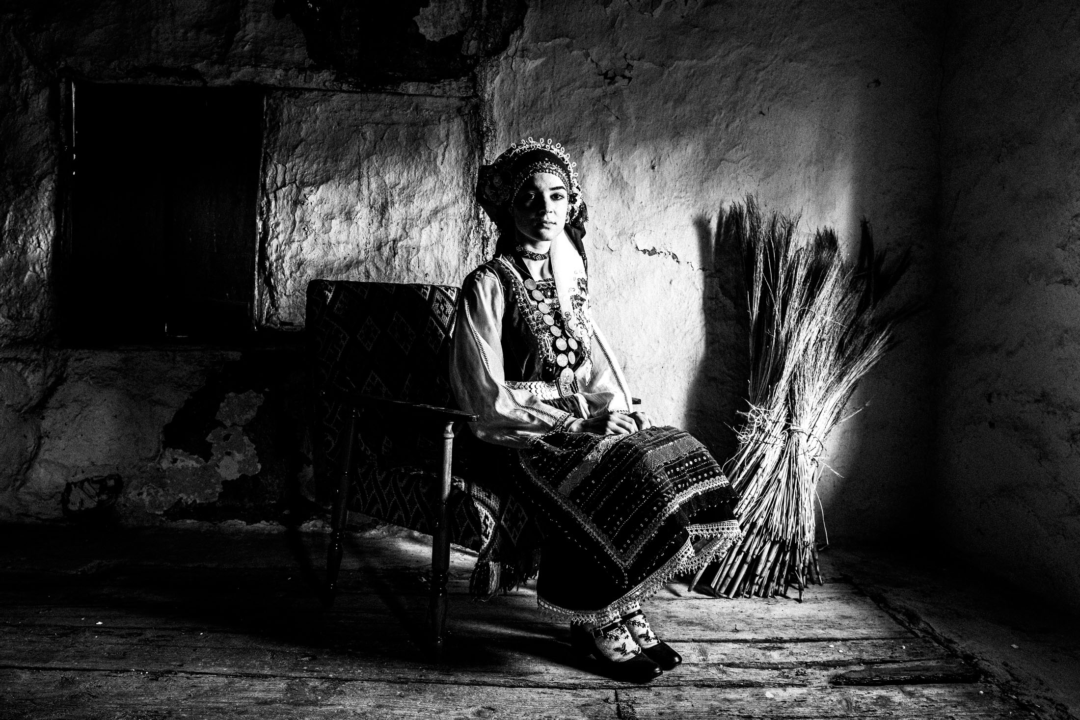 Woman wearing the local costume of Metaxades, inside a local house. Evros, Thrace