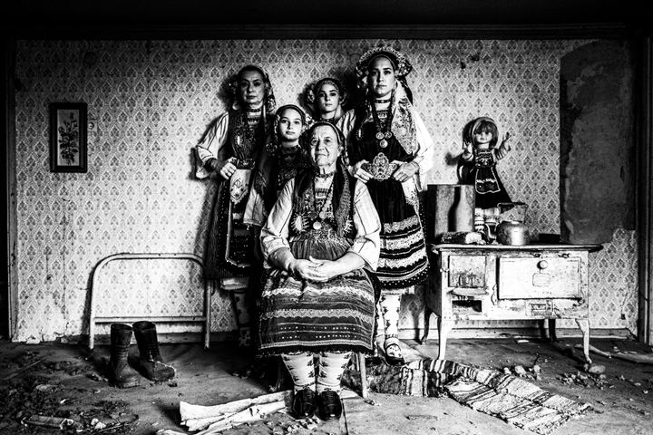 Women wearing the local costume of Metaxades, inside a local house. Evros, Thrace