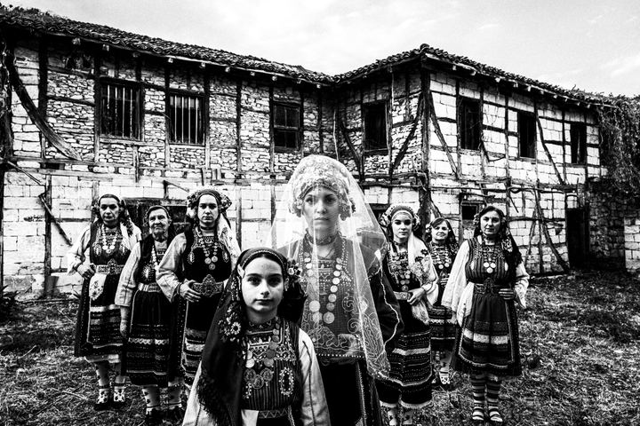 Bride and relatives outside a local house in Metaxades, wearing the local costumes.