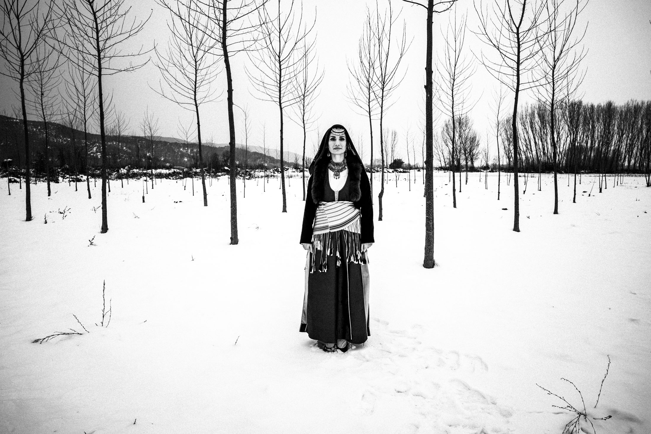 Ourania wearing the traditional Pontic costume in lake Kerkini. The lake is frozen.