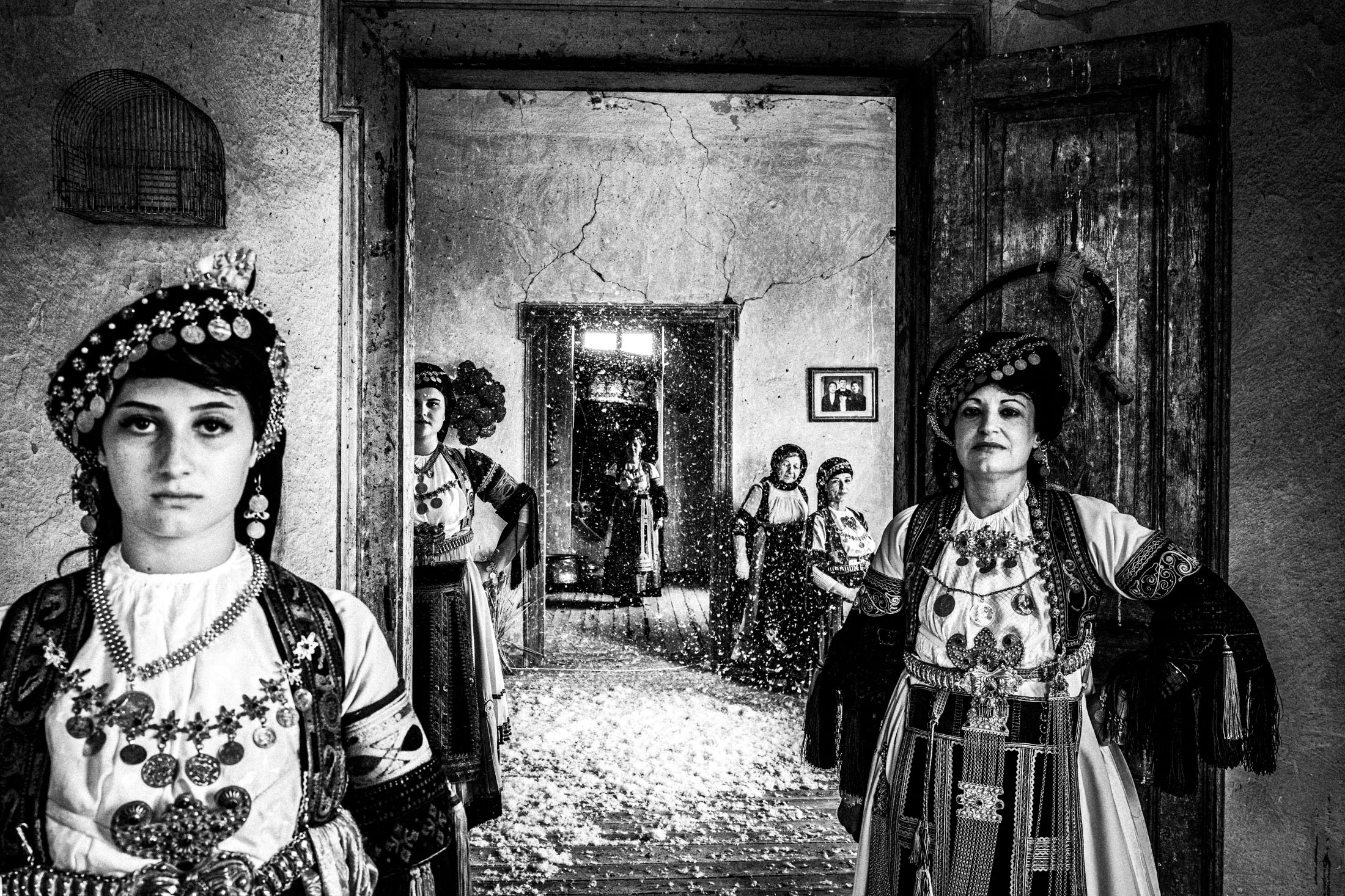 Six women wearing the costumes of Karagouna inside an old local Mansion in Glinos, Trikala