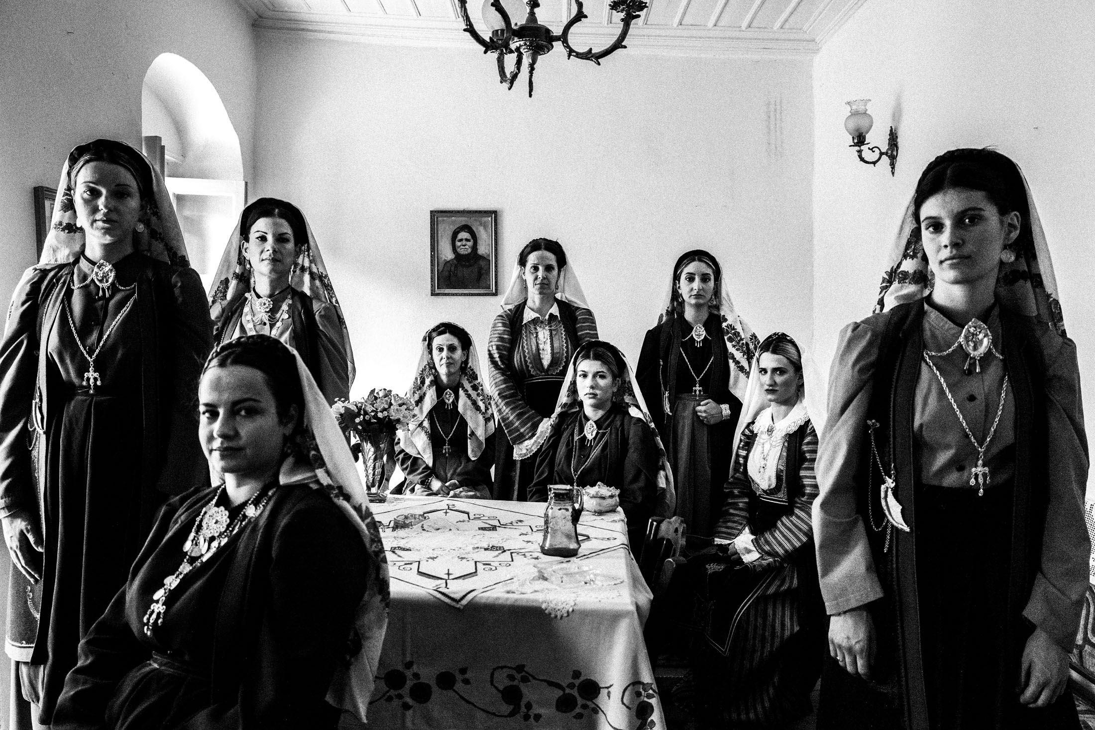 Women wearing the local dresses of Platanos, Nafpaktia, inside a local house