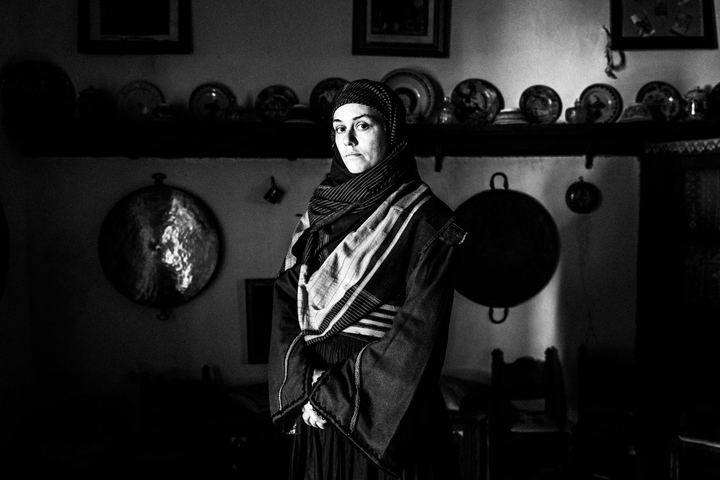 Women wearing the local costumes of Skyros, standing near the beach on the island