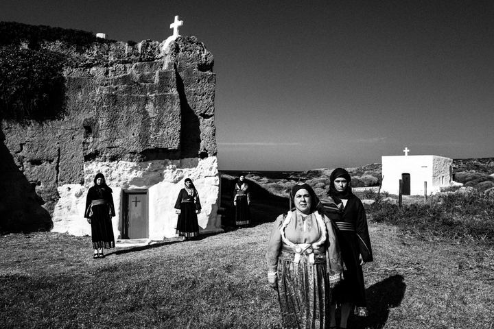 Women wearing the local costumes of Skyros, standing near the beach on the island