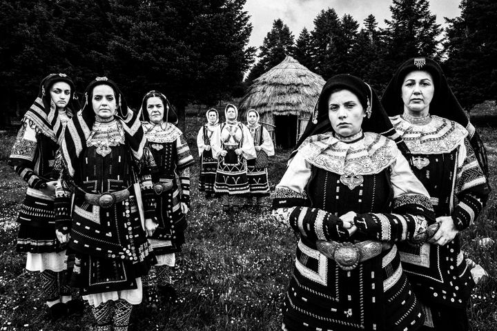 Women wearing the costumes of Sarakatsani in a forest in Karpenissi, Evrytania