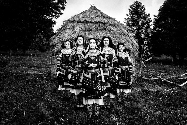 Women wearing the local Sarakatsani costumes at a local forest