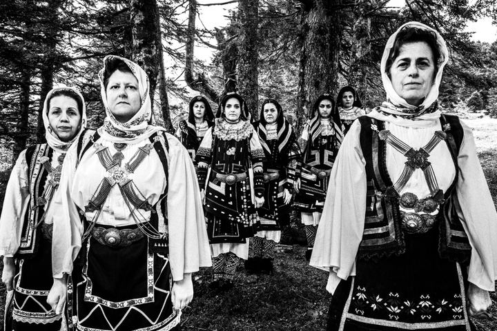 Women wearing the local Sarakatsani costumes at a local forest
