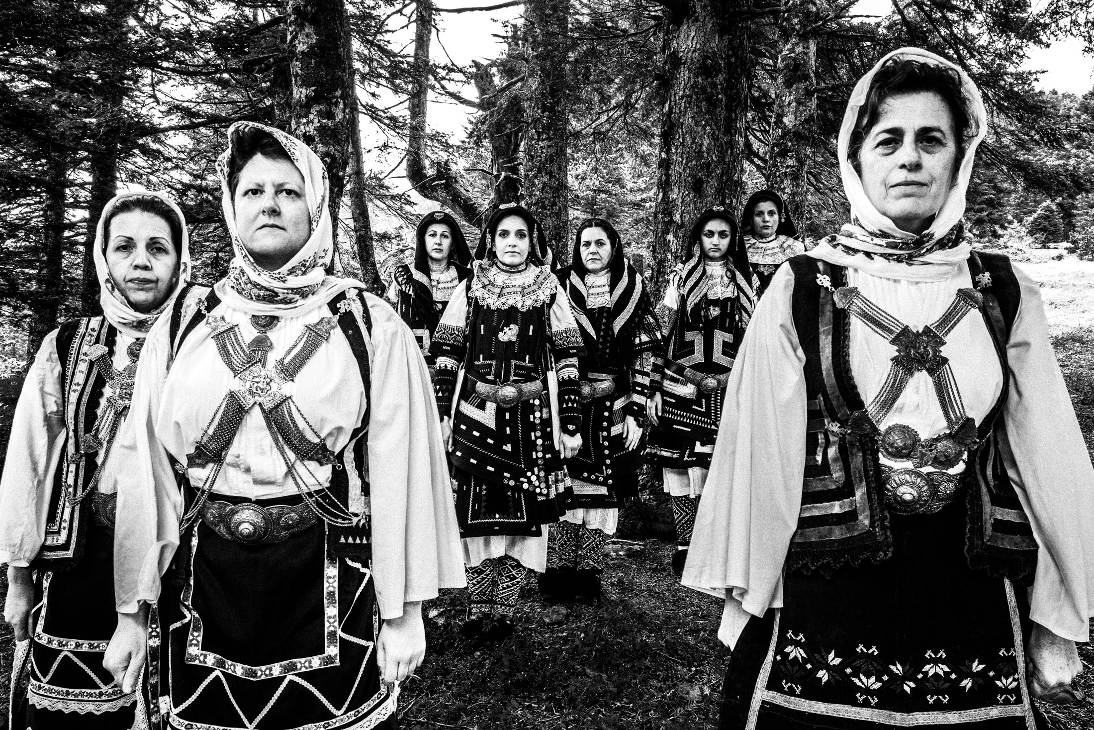 Women wearing the local Sarakatsani costumes at a local forest