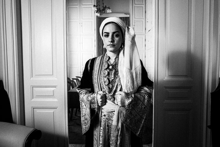 A woman wearing the local urban costumes of Kalamata, standing inside the Lyceum Club of Greek Women Kalamata