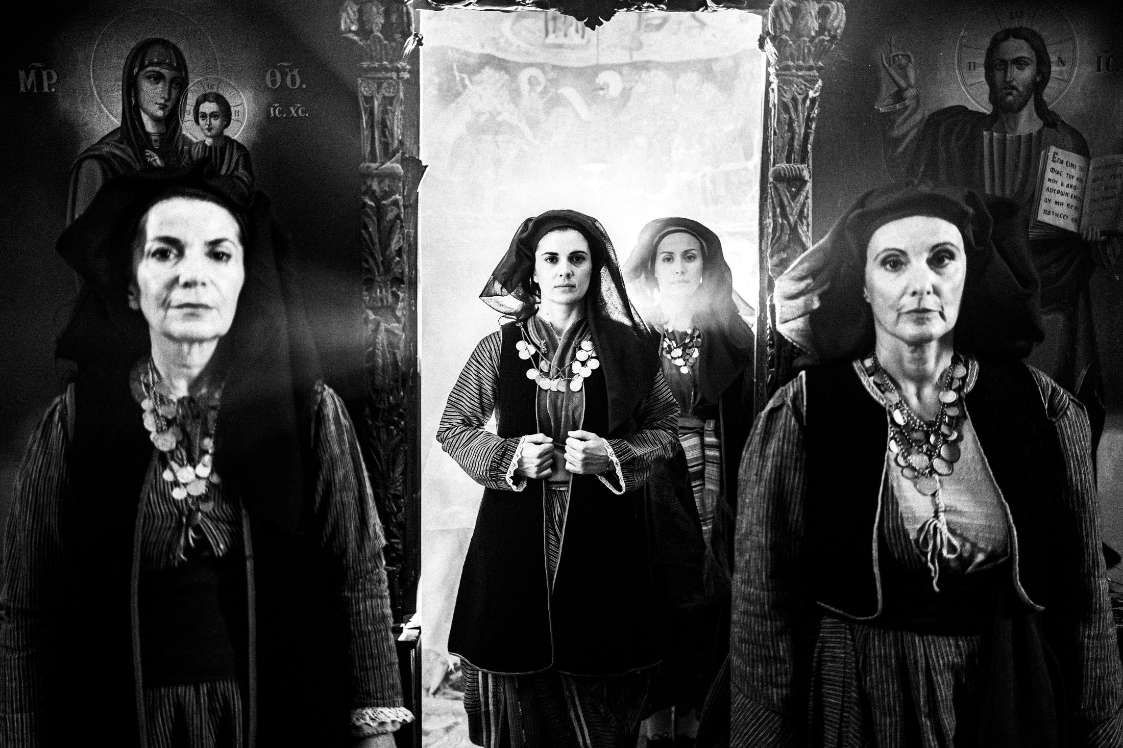 Four women, wearing the local dresses of Alagonia, photographed inside the church of Mardaki monastery
