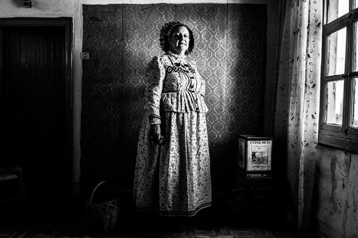 Woman wearing the local costume of Nea Vyssa, inside a local house. Evros, Thrace, Greece
