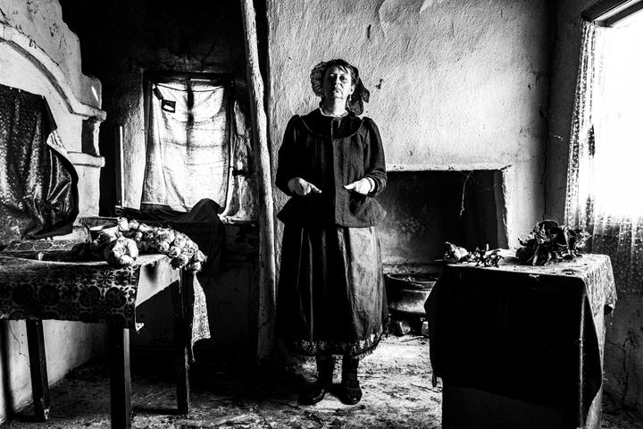 Woman wearing the local costume of Nea Vyssa, inside a local house. Evros, Thrace, Greece