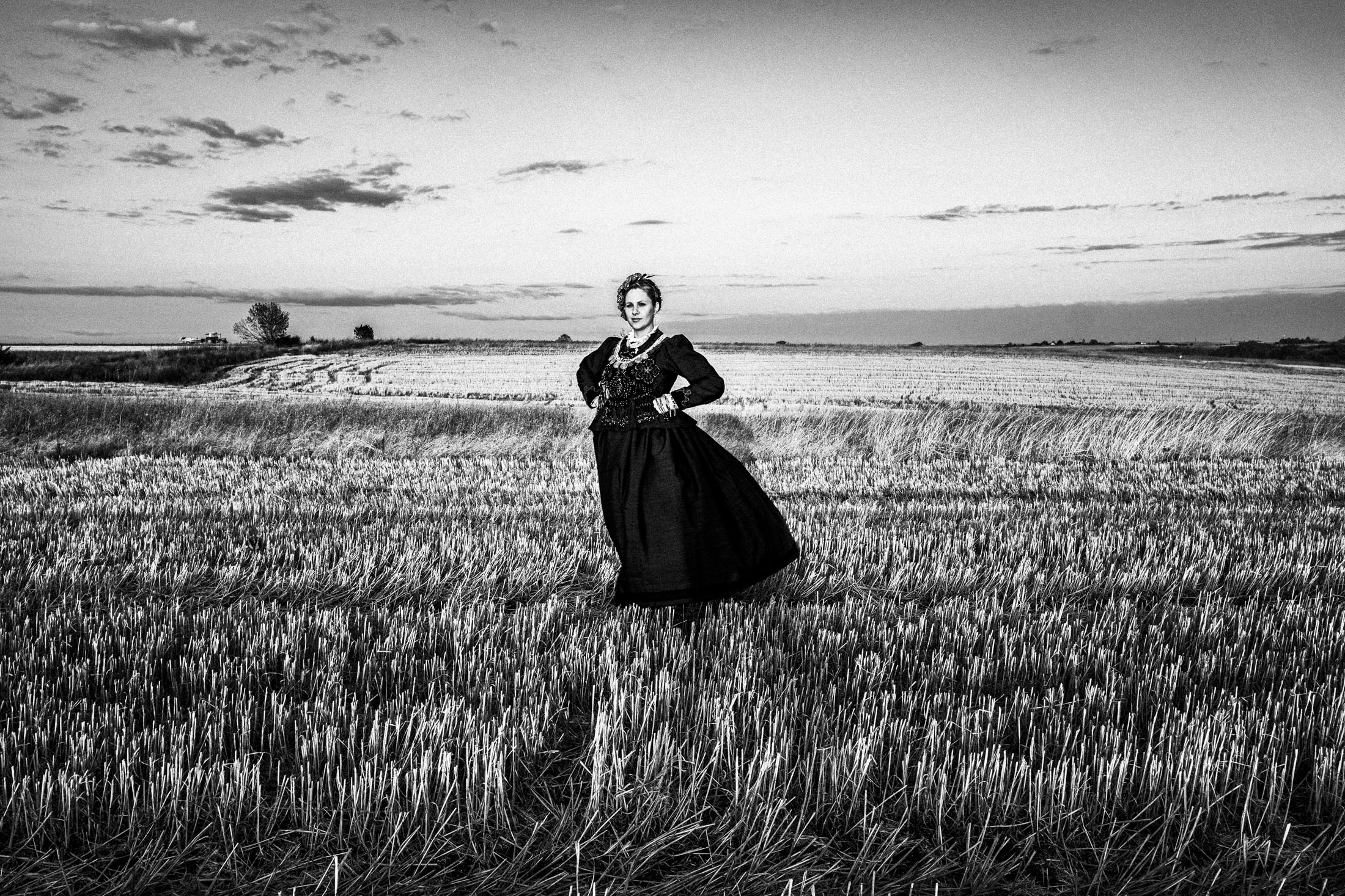Woman wearing the local costume of Nea Vyssa, at a local field. Evros, Thrace, Greece