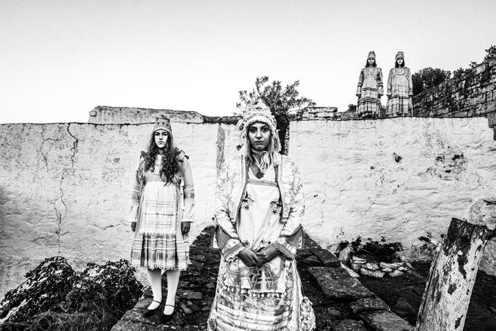 Women wearing the local costumes of Thymiana at a local monastery