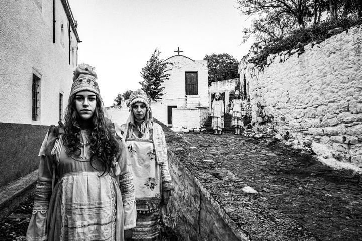 Women wearing the local costumes of Thymiana at the local monastery