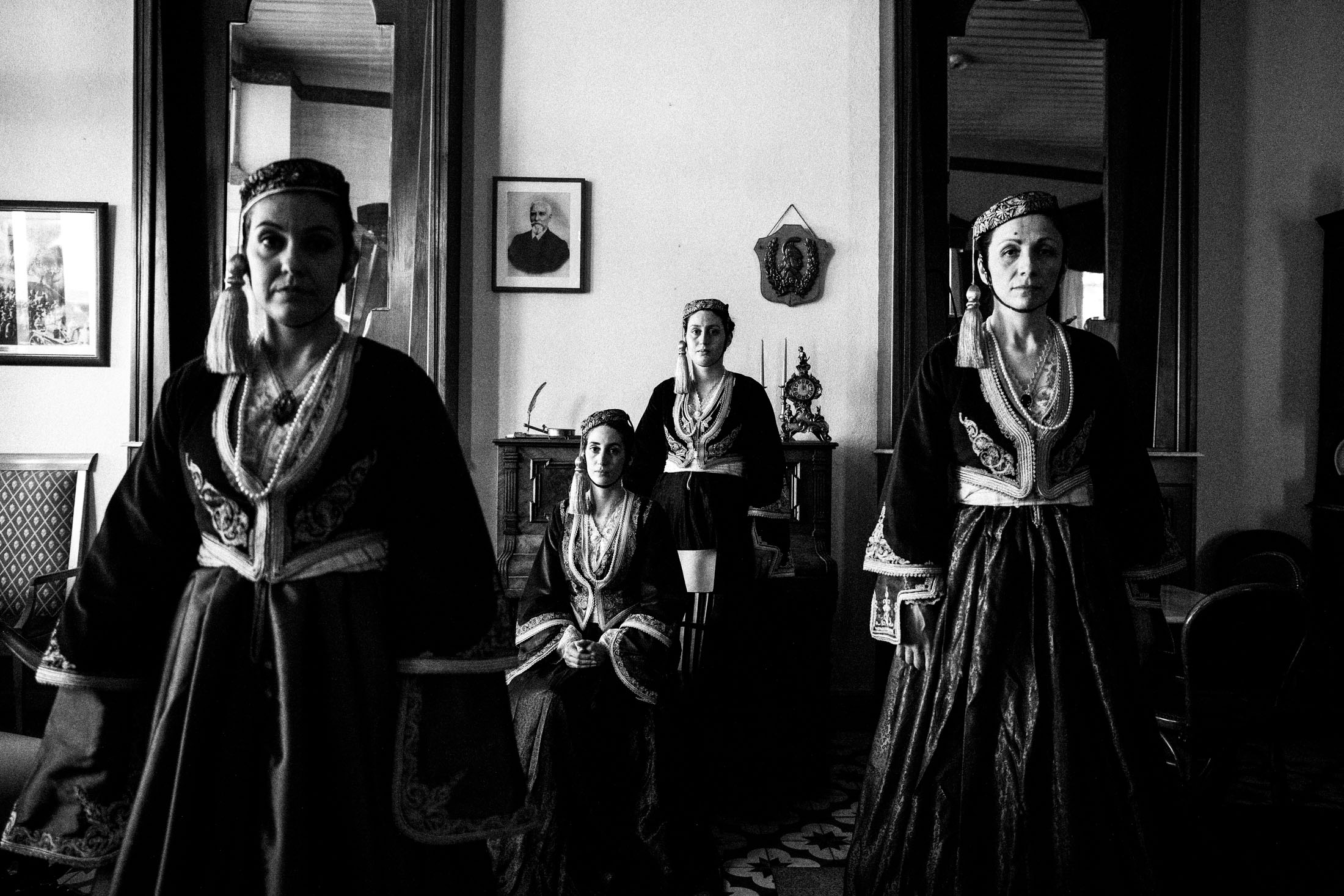 Four women wearing the Amalia traditional urban costume, inside a cafe in Tripolis, Peloponnese