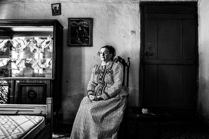 Woman wearing the local costume of Nea Vyssa, inside a local house. Evros, Thrace, Greece