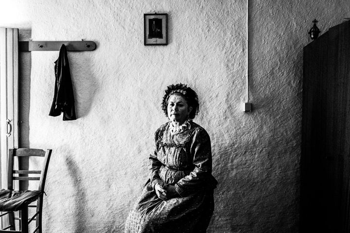 Woman wearing the local costume of Nea Vyssa, inside a local house. Evros, Thrace, Greece