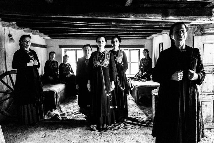 A group of women wearing the costumes of the nomadic group of vlachs, inside a house in Seli, Imathia.