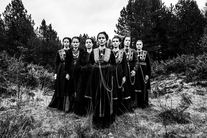 Women wearing the costumes of the nomadic group of the vlachs, posing at Seli, Veria, in formation outdoors