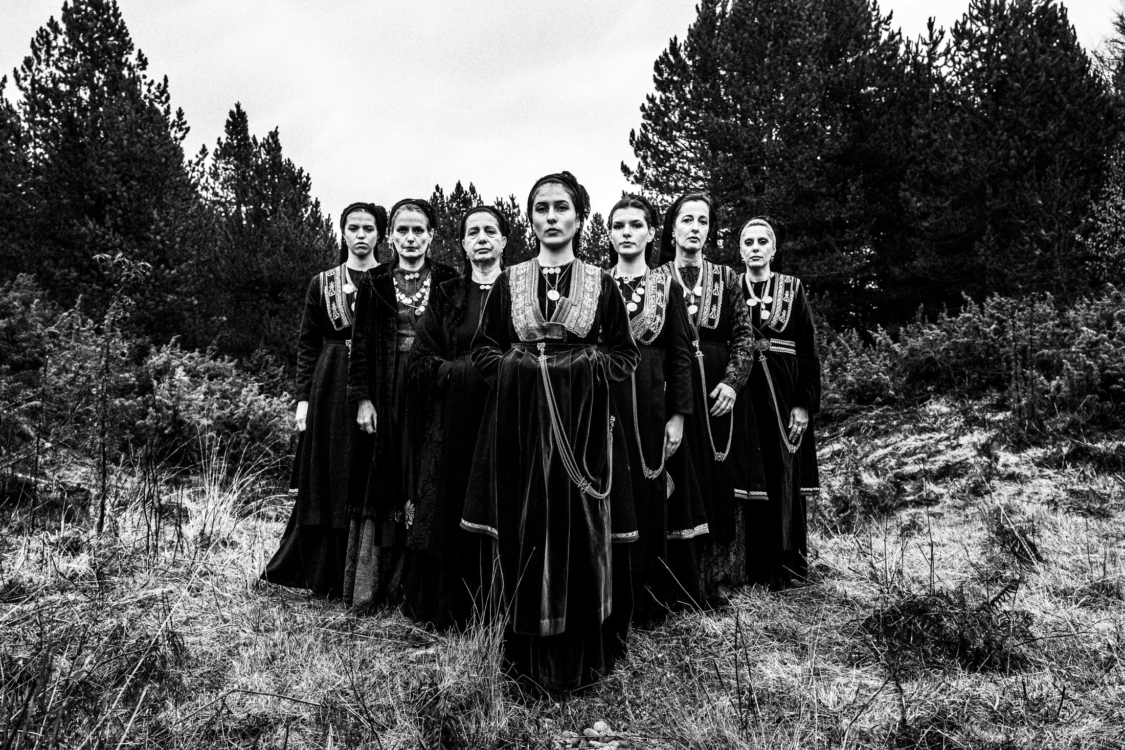 Women wearing the costumes of the nomadic group of the vlachs, posing at Seli, Veria, in formation outdoors