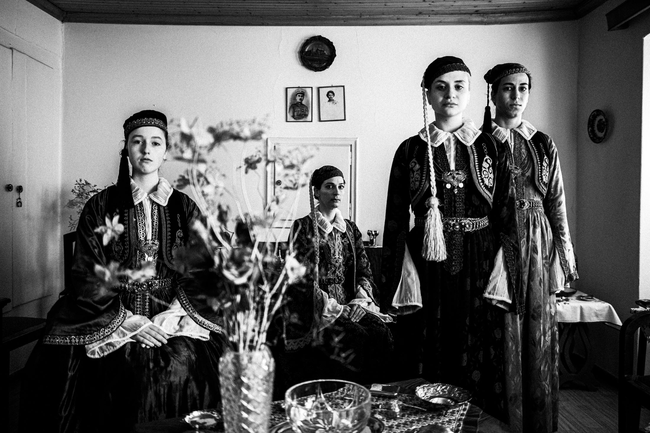 Women wearing the local urban dresses of Ioannina, Epirus, including the Pirpiri, inside a local town house