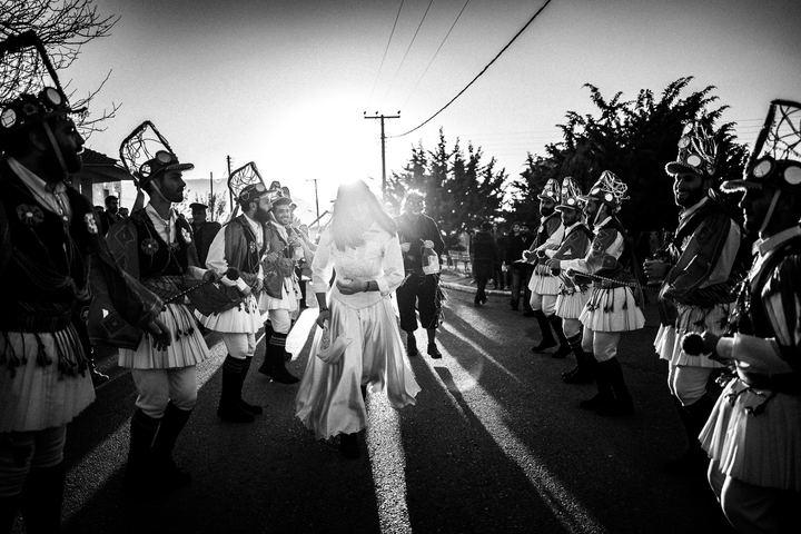 The ritual bride walking between two lines of Kotsamania dancers.