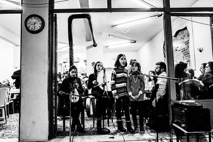 Night celebration at the village of Pyrgi in Drama - Kids singing with orchestra