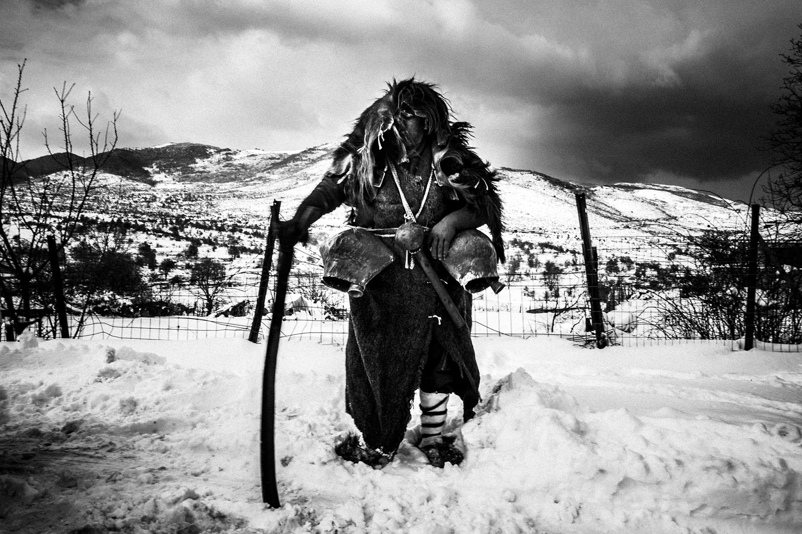 A bell-bearer in the snow in the village of Volakas, Drama