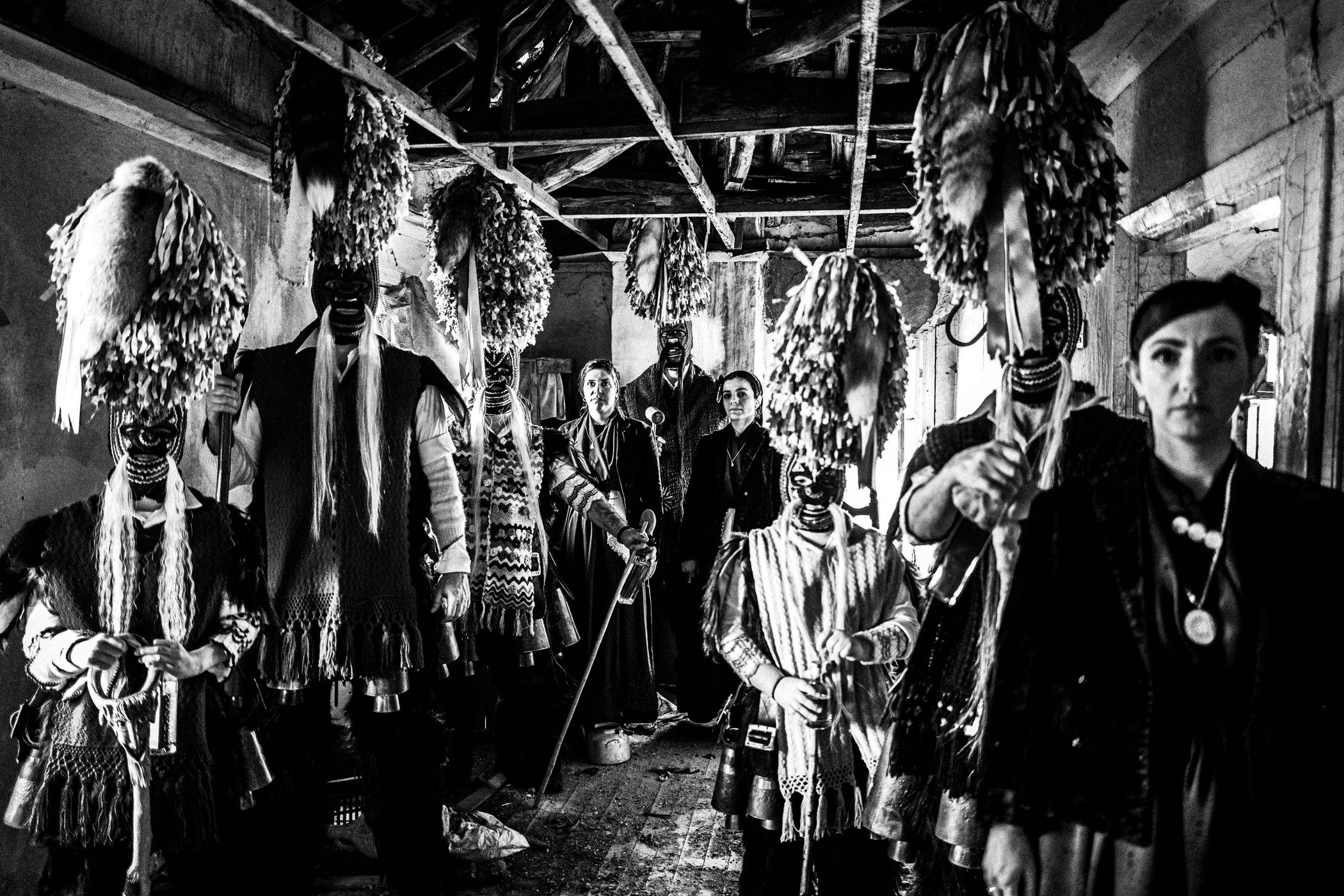 Group portrait of Koudounoforoi and women in the local dress of Sohos.
