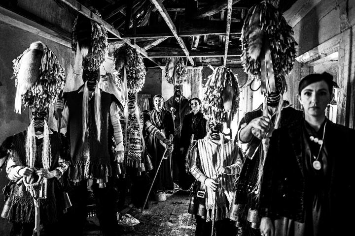 Group portrait of Koudounoforoi and women in the local dress of Sohos.