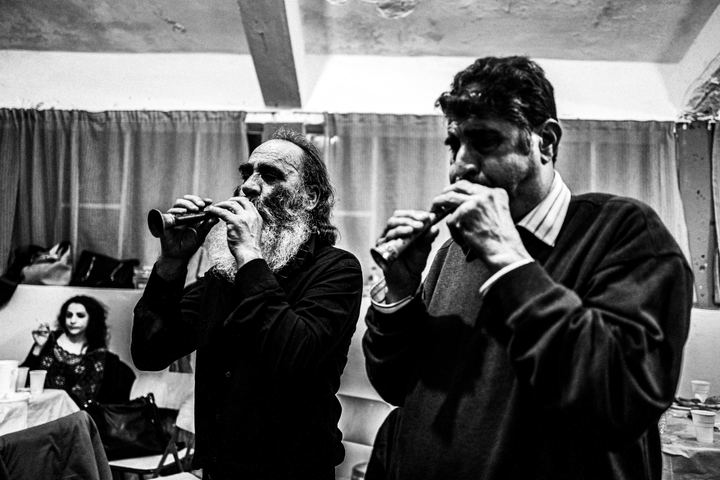 Two musicians playing traditional zournas during the winter festival.