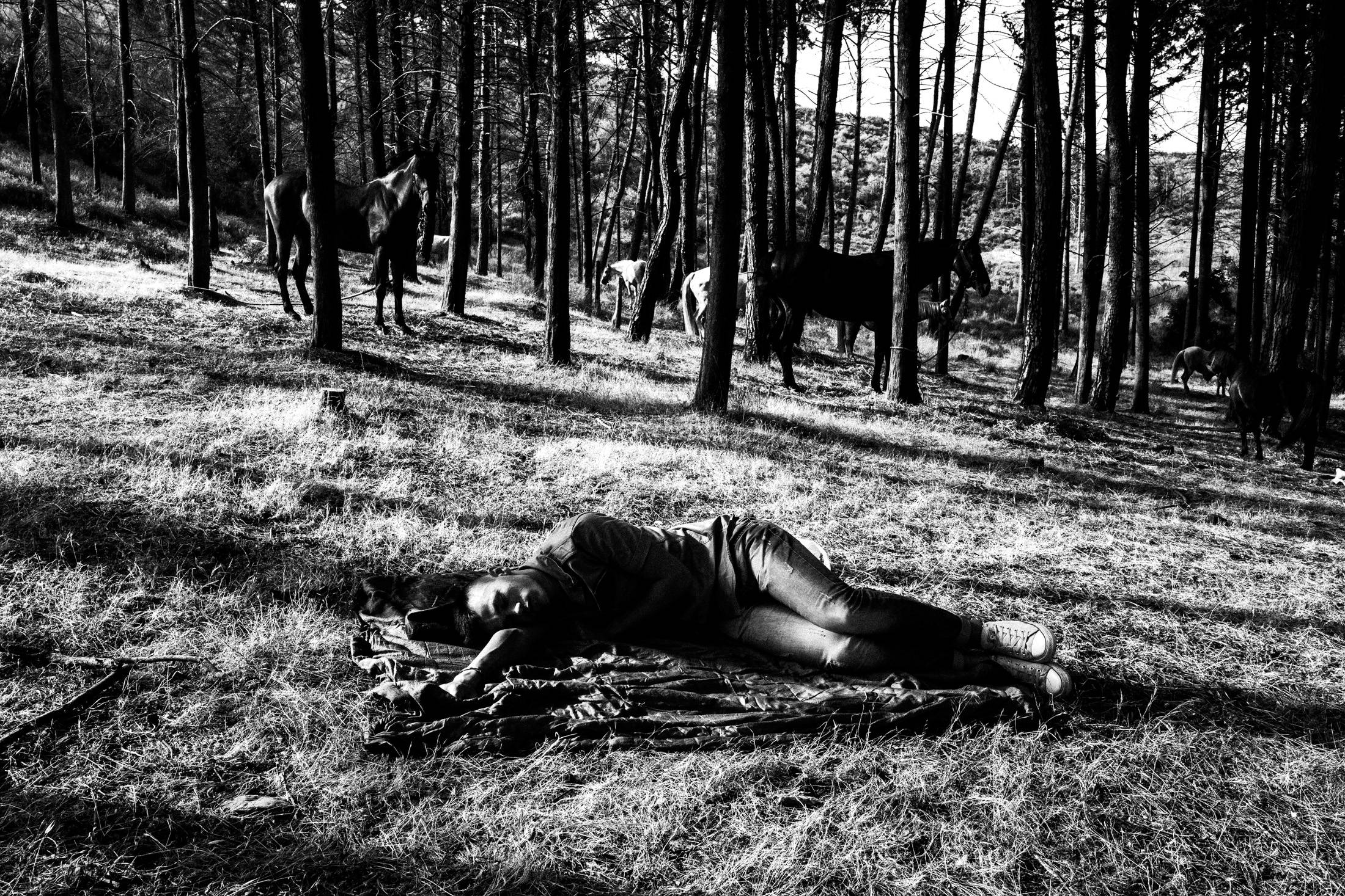 People resting in the woods around Saint Simeon after the all-night festival.