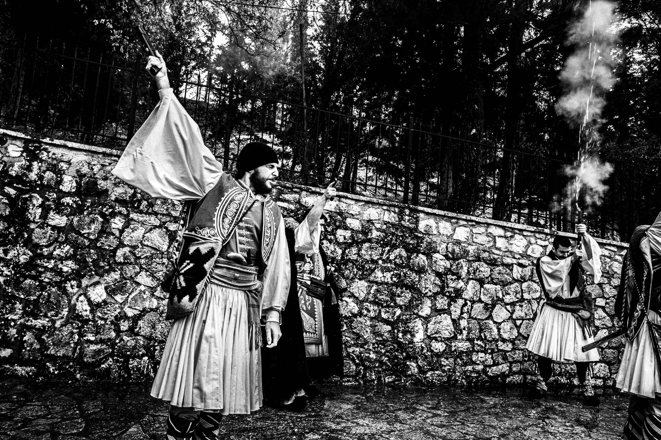 A dramatic moment during the blank-firing sequence at Agia Lavra.