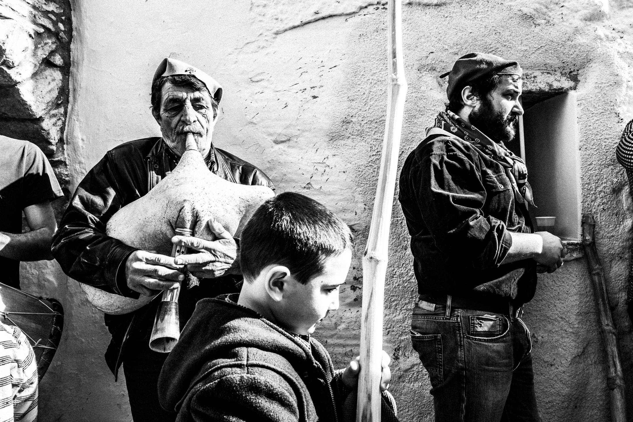 Traditional musicians playing during the Koudounatoi procession.
