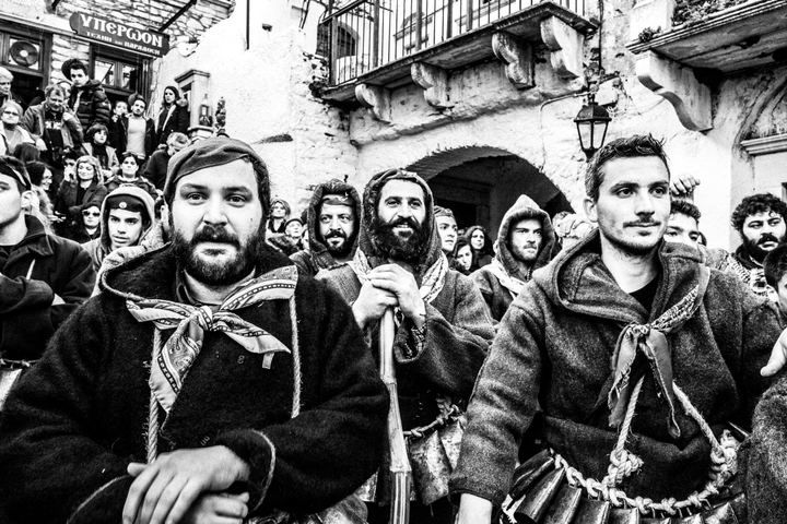 A group of Koudounatoi moving through the Carnival crowd in Apeiranthos.