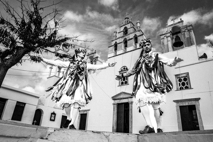 Two men wearing ribboned Kordelatoi costumes in Filoti, Naxos.