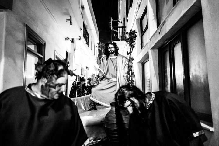 Dionysian Carnival performers dancing through the old town of Naxos.