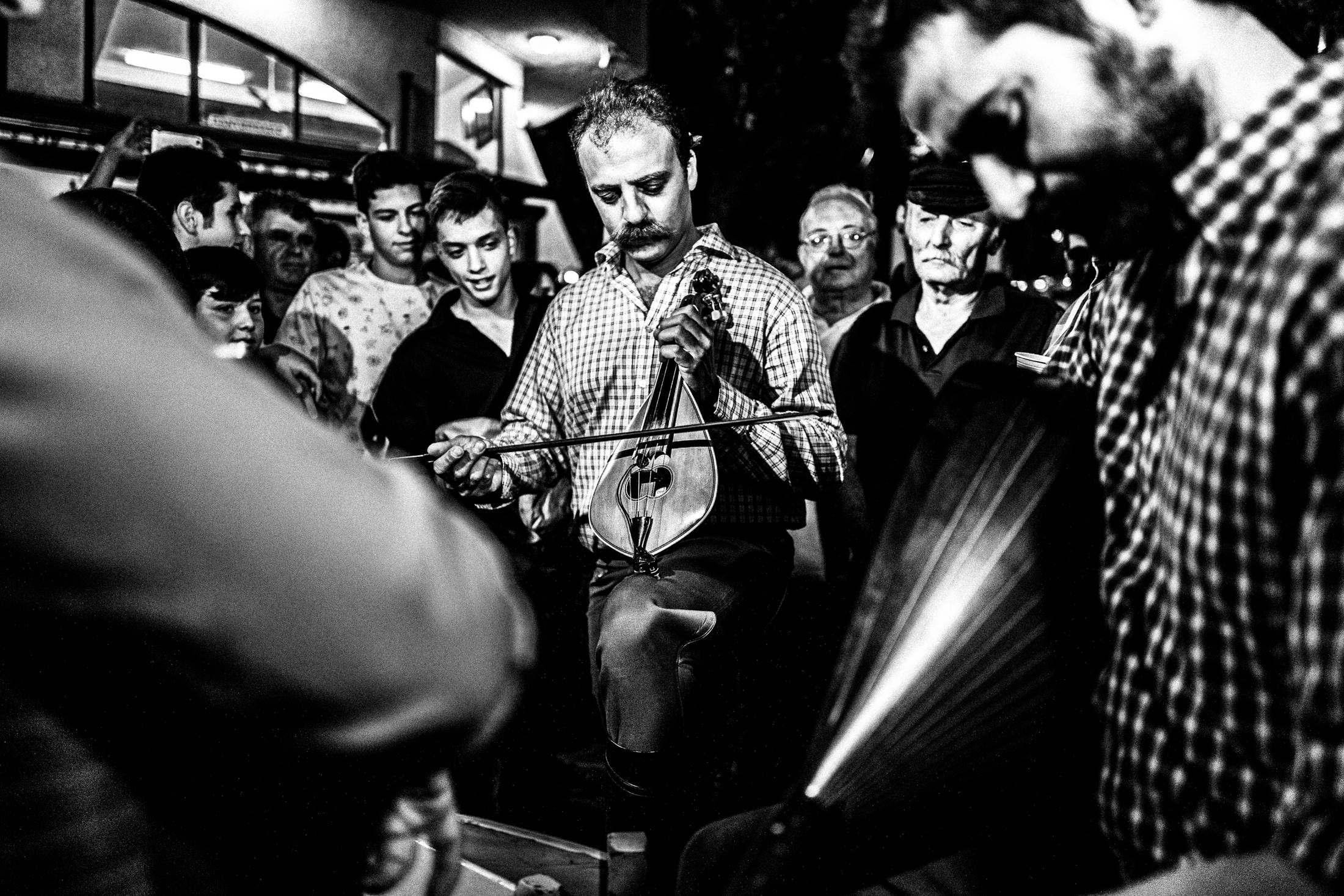Musicians performing at night in Spili.