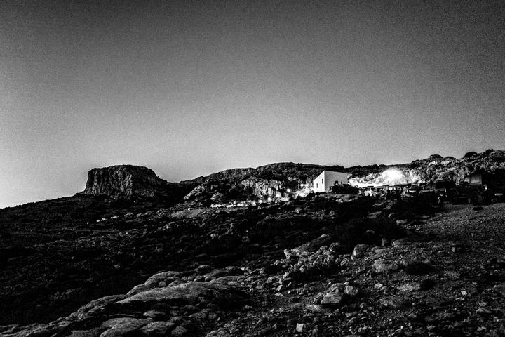 Saint Fanourios chapel lit at night during the annual festival.