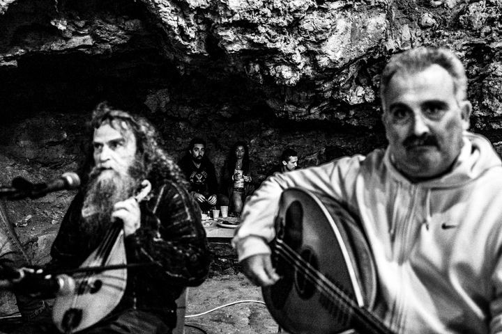 Musicians and singers performing beside the chapel.