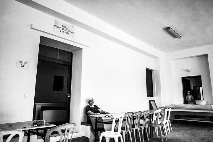 A woman sitting outside the galley of Agia Paraskevi on Amorgos