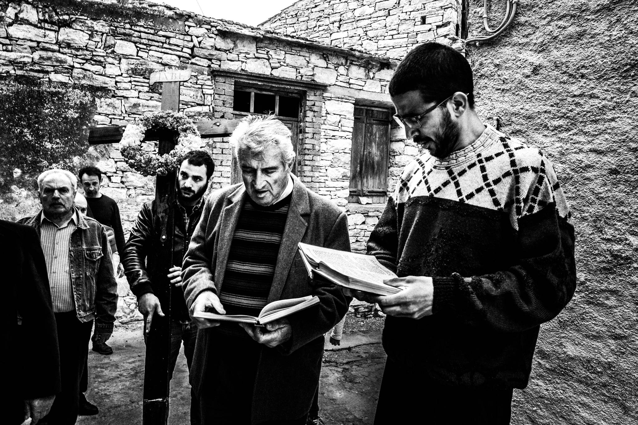 The priest and chanters reading during the Good Friday procession in Patrika.